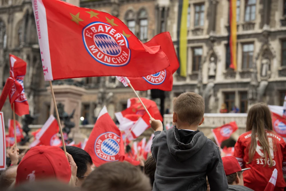 Bayern Munich fans in crowd with a flag