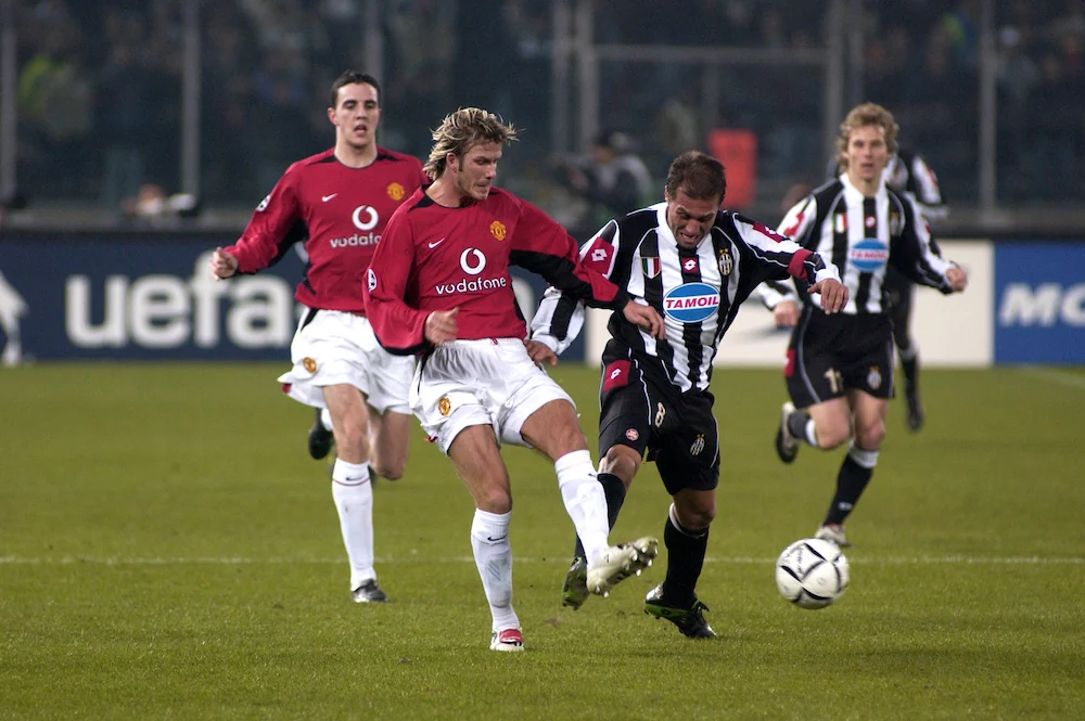 David Beckham (Manchester United) and Antonio Conte (Juventus) in action during the match
