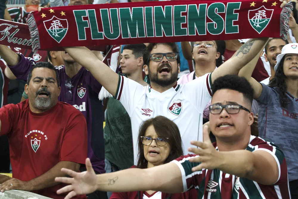 Fluminense supporter holding up a scarf