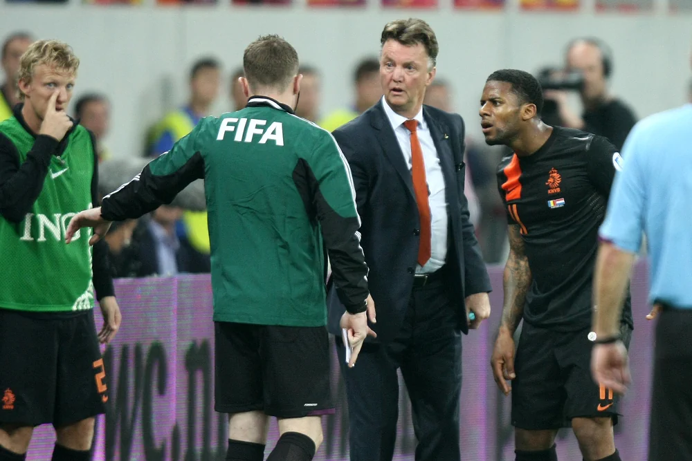 Louis van Gaal chatting with some FIFA referees