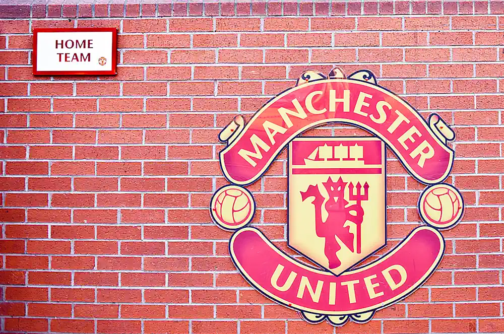 Manchester United logo on the wall