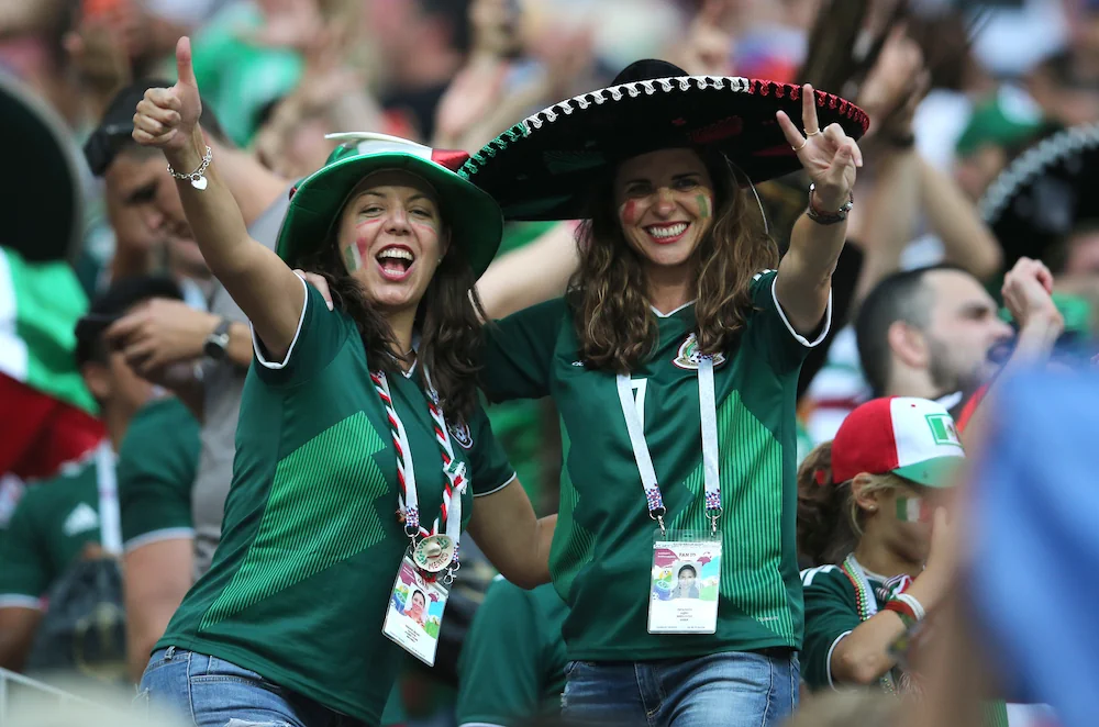 Female Mexican football fans at a match