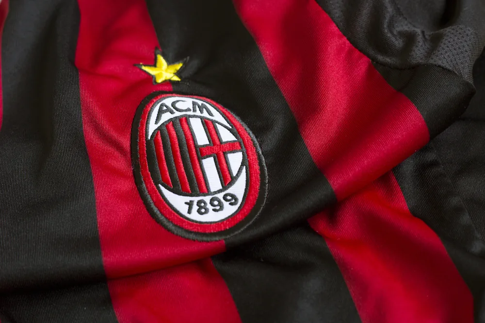AC Milan emblem on football jersey