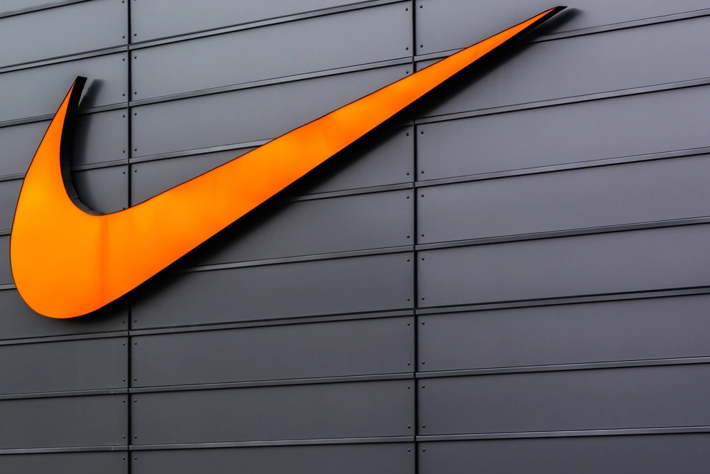Nike - logo on grey wall