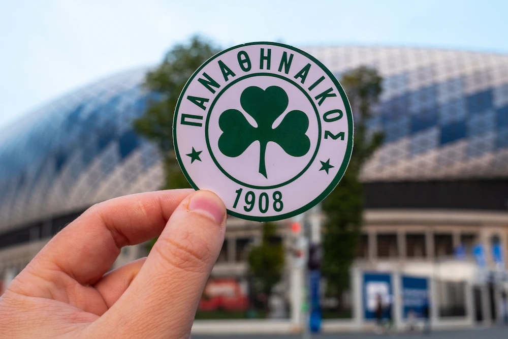 Panathinaikos logo in front of a stadium