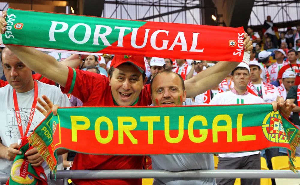 Portugal fans holding up scarfs