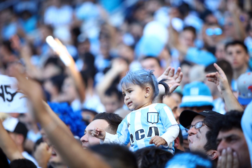 Young fan of Racing Club during a match