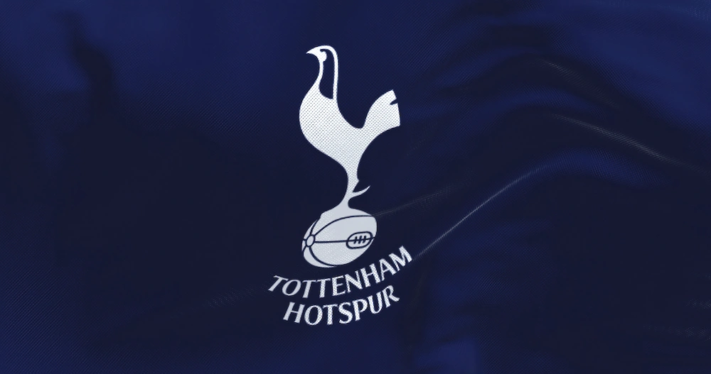 Tottenham Hotspur white logo on blue shirt