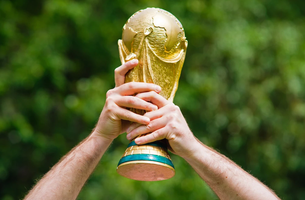 World Cup trophy holding up