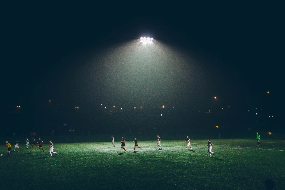 Players in the on a dark football field