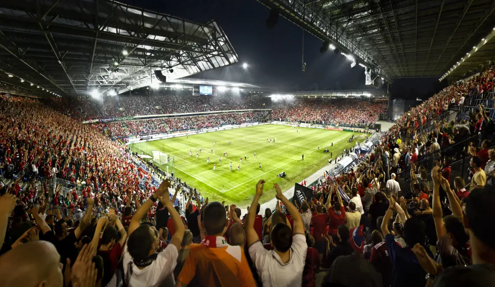 Football field with spectators around it