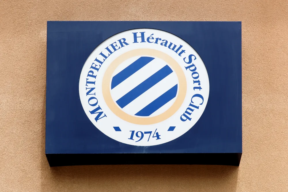 Montpellier logo displayed on a wall