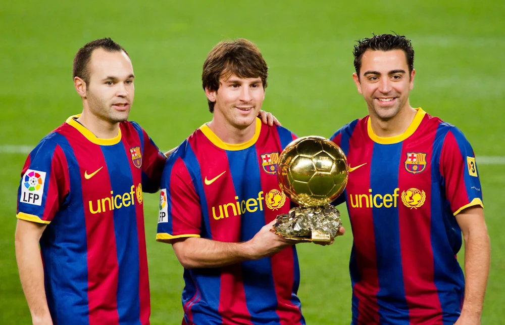 Xavi together with Lionel Messi and Andrés Iniesta